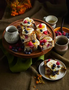 pancake tray bake with mixed berries and banana