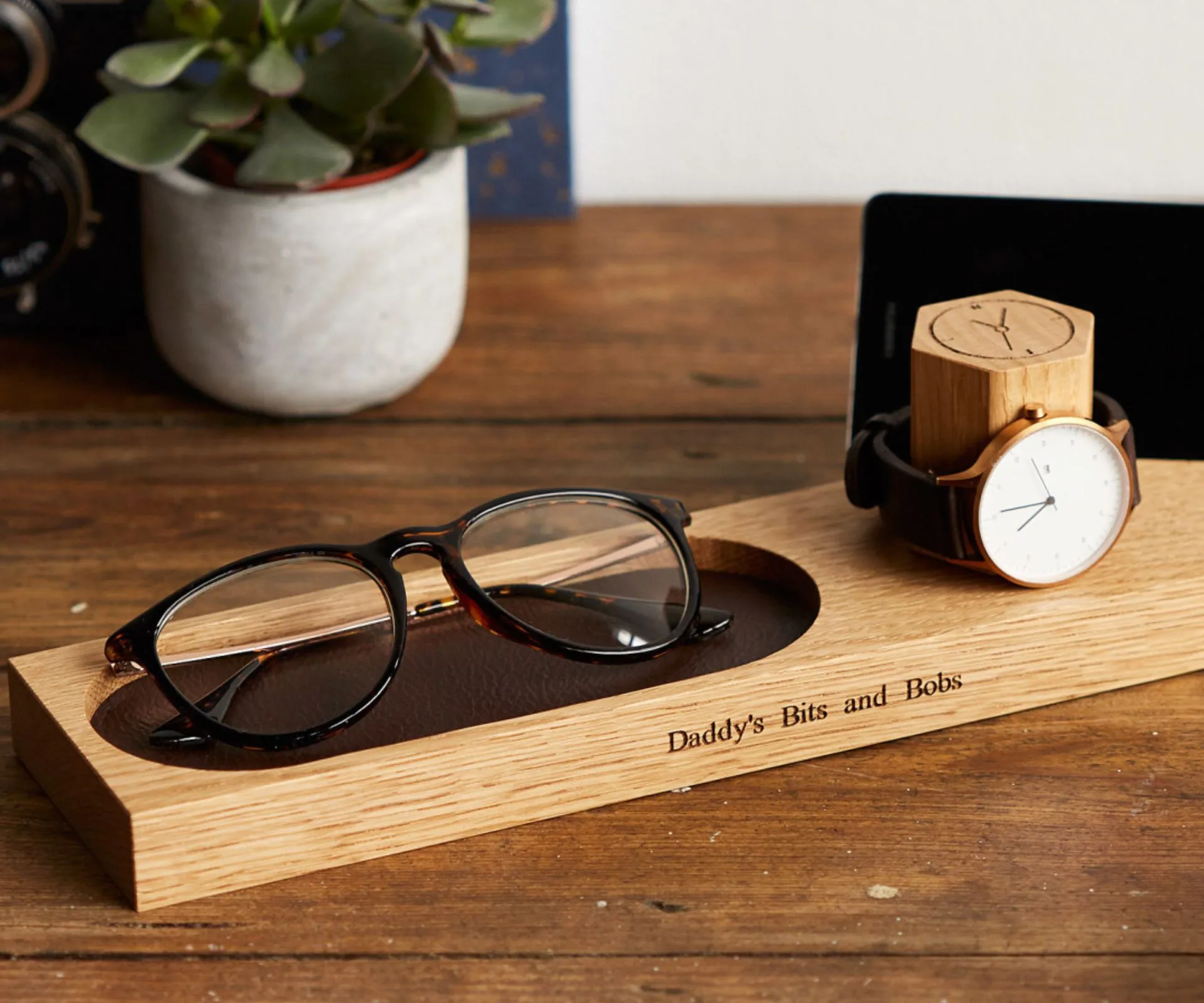 personalised bedside watch and phone stand with glasses 