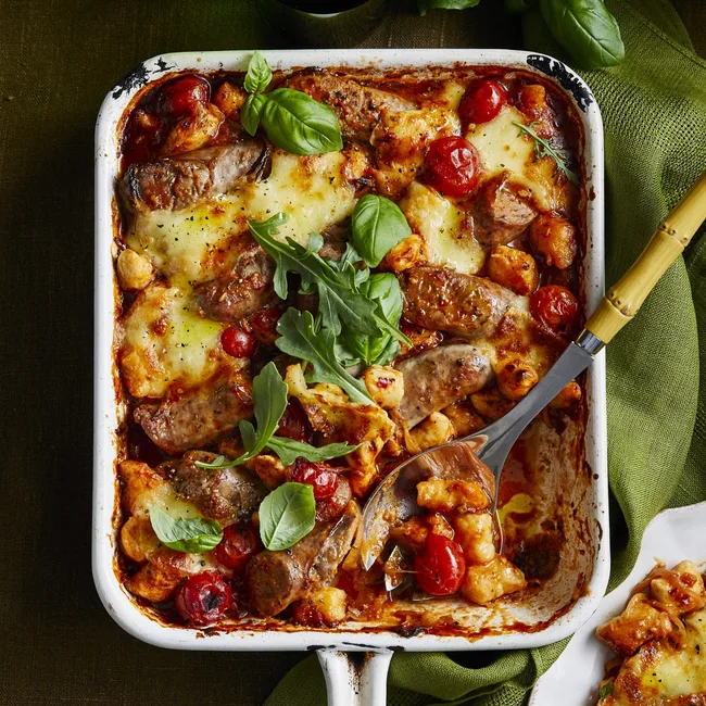gnocchi and sausage tray bake with basil on top