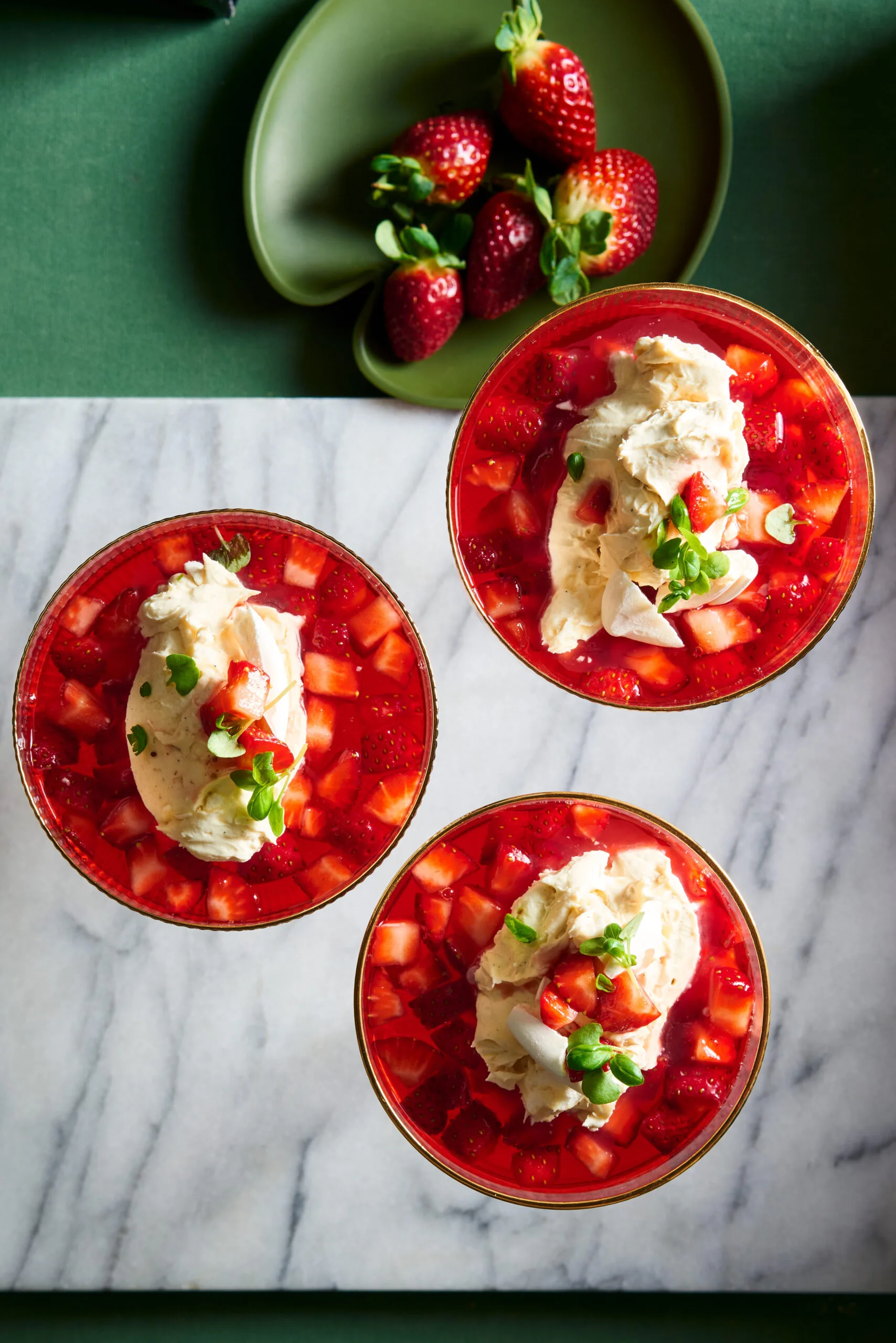 strawberry consomme in three bowls
