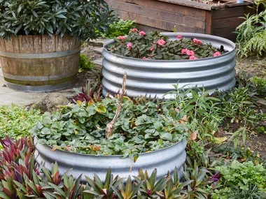 two raised garden beds made out of corrugated iron