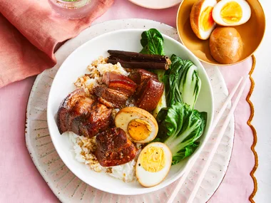 braised pork belly on a pink table place mat