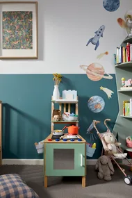 kids play kitchen long shot with chair converted into play equipment in centre