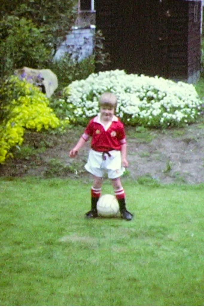 david beckham as a child dressed in soccer outfit
