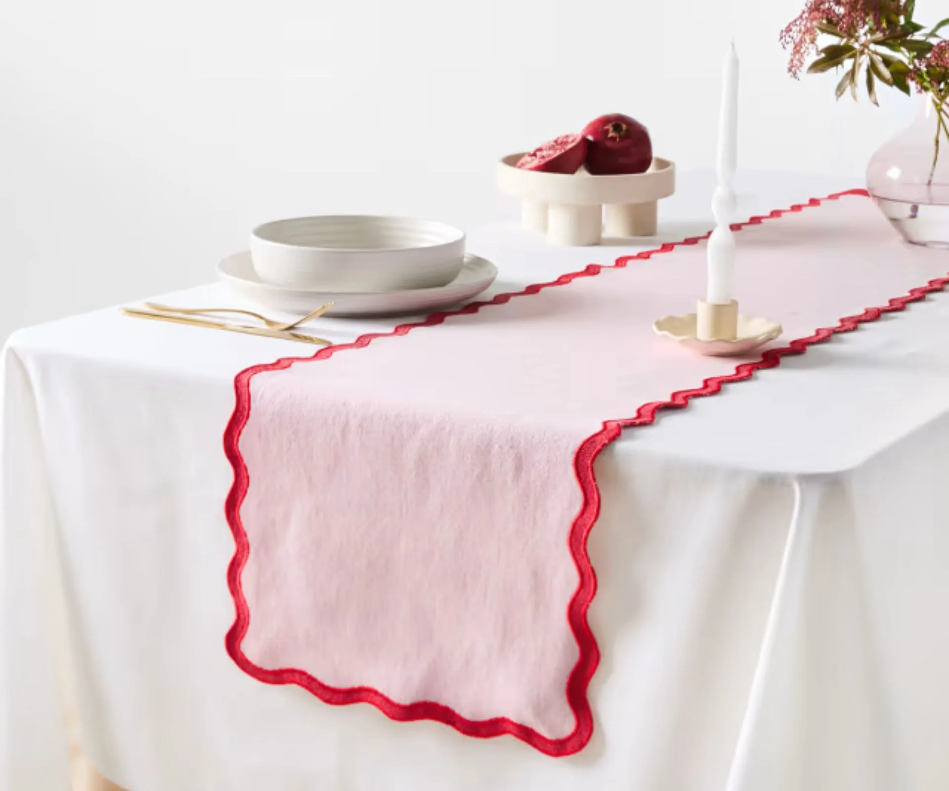 pink wavy table runner on a table on a set table