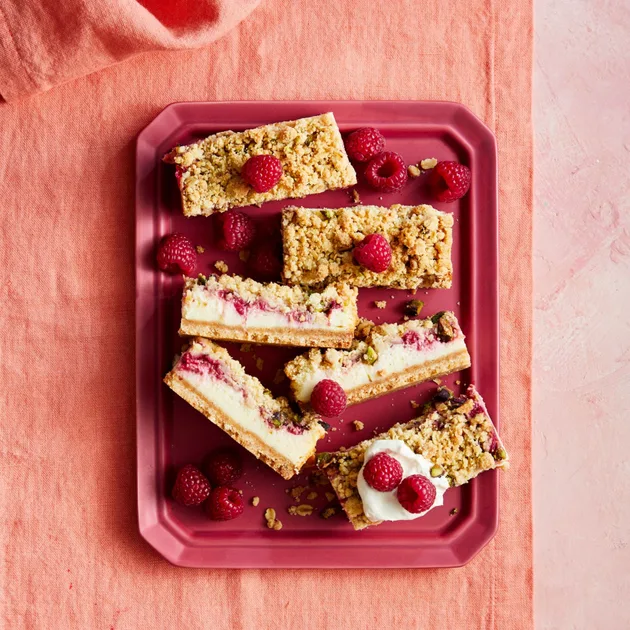Raspberry crumble bars with cheesecake and pistachio - Better Homes & Gardens Australia