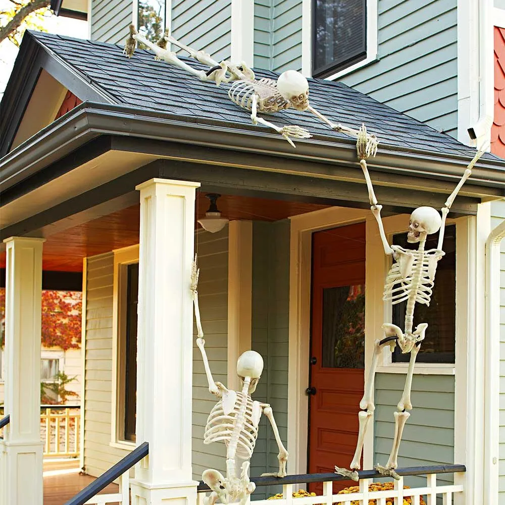 Funny Halloween skeletons posing on balcony