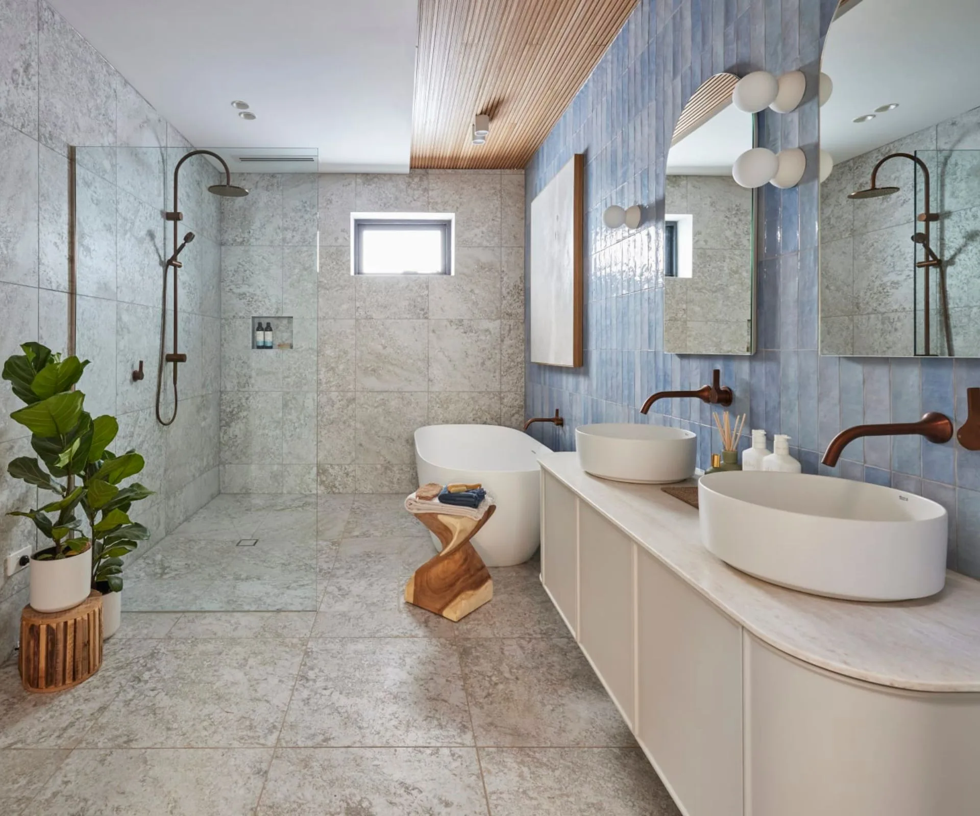 bathroom with blue tiles and ceiling wooden slats