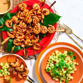 red curry prawn skewers with a fresh fruit salad