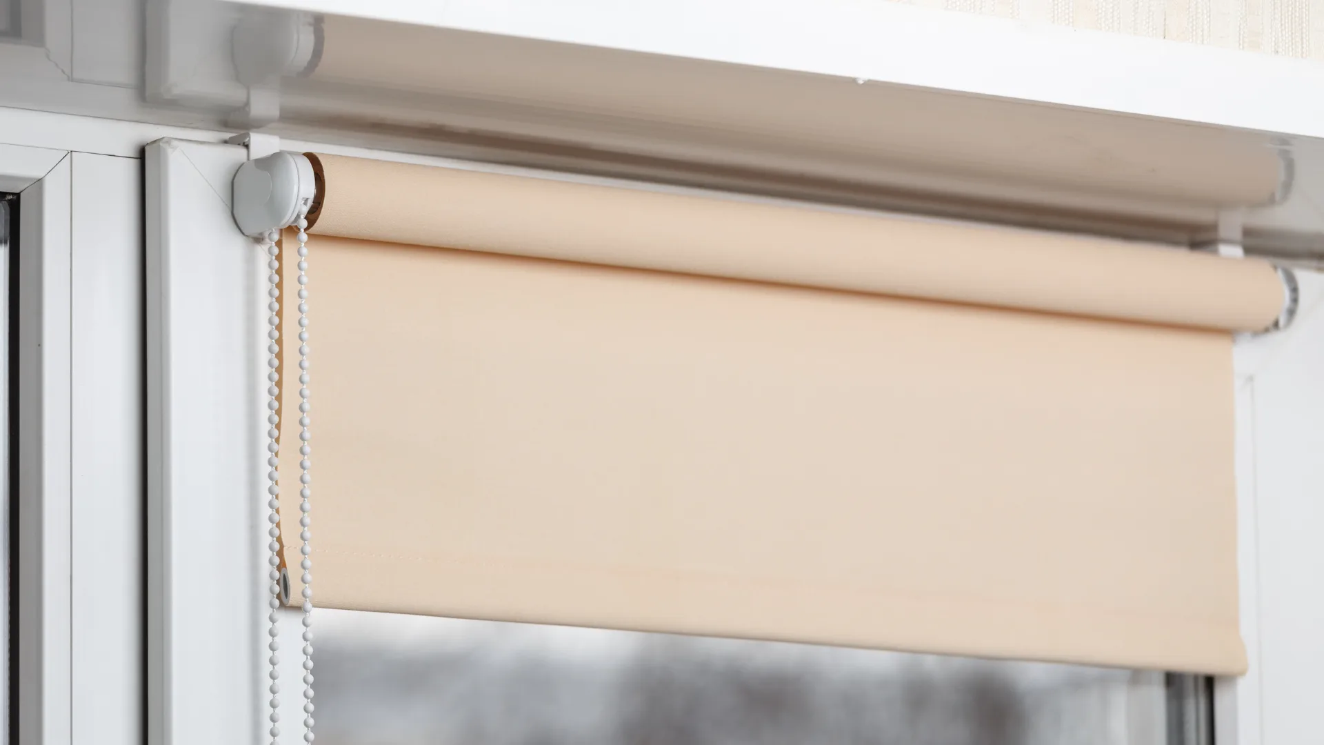 Peach colour roller blind close up