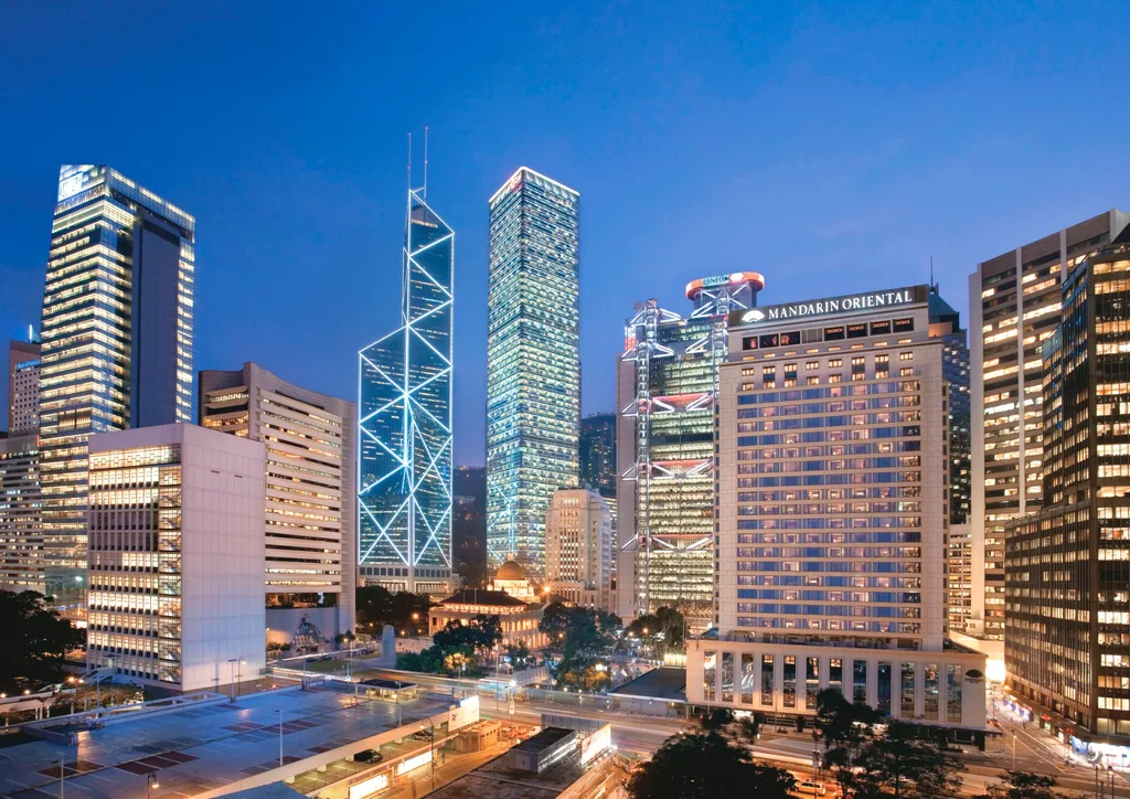 close up of large skyscrapers in hong kong including hot spot of mandarin oriental in the centre of the image