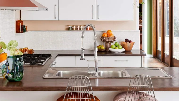 modern kitchen with white paintable wallpaper splashback and coral walls