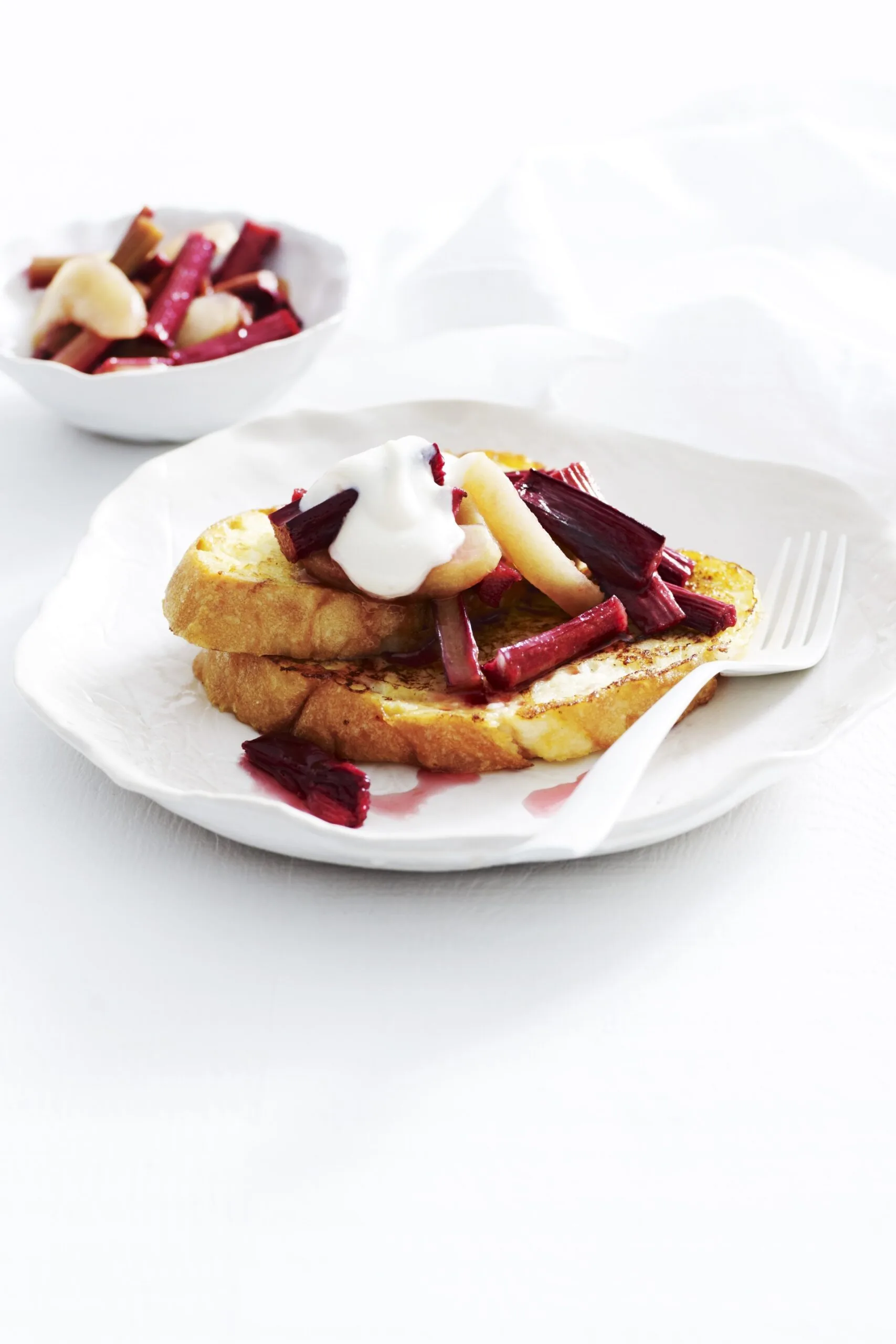 french toast with cream and stewed apple on top