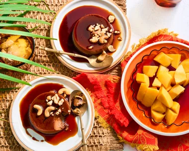 two bowls with creme caramel done like sri lankan watalappan with bowl of mango on the side