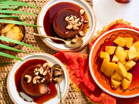 two bowls with creme caramel done like sri lankan watalappan with bowl of mango on the side