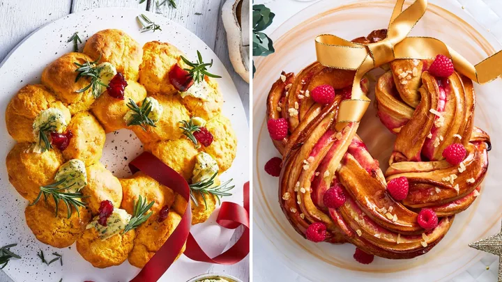 Savory scone wreath with herbs and berries next to a sweet braided bread wreath with raspberries and golden ribbon.