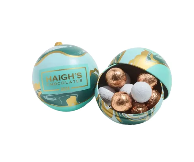 haighs teal bauble open with chocolates coming out