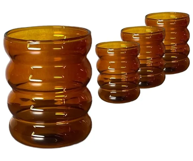 amber coloured glasses with bubble texture on them