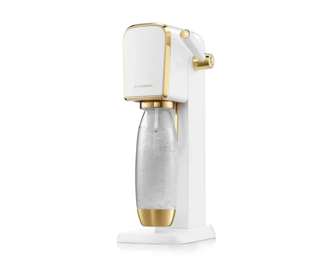 White and gold SodaStream sparkling water maker with a clear bottle.