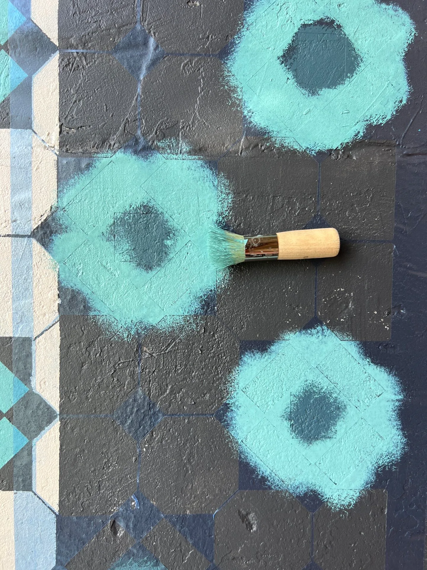 painted stencil floor with wooden brush