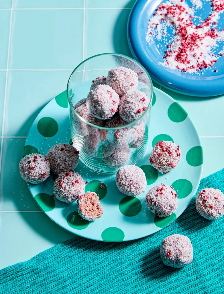 coconut chocolate balls in cup on blue background