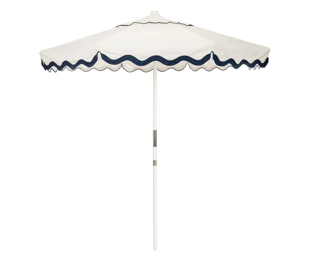 scalloped trim outdoor umbrella with wavy navy line at trim