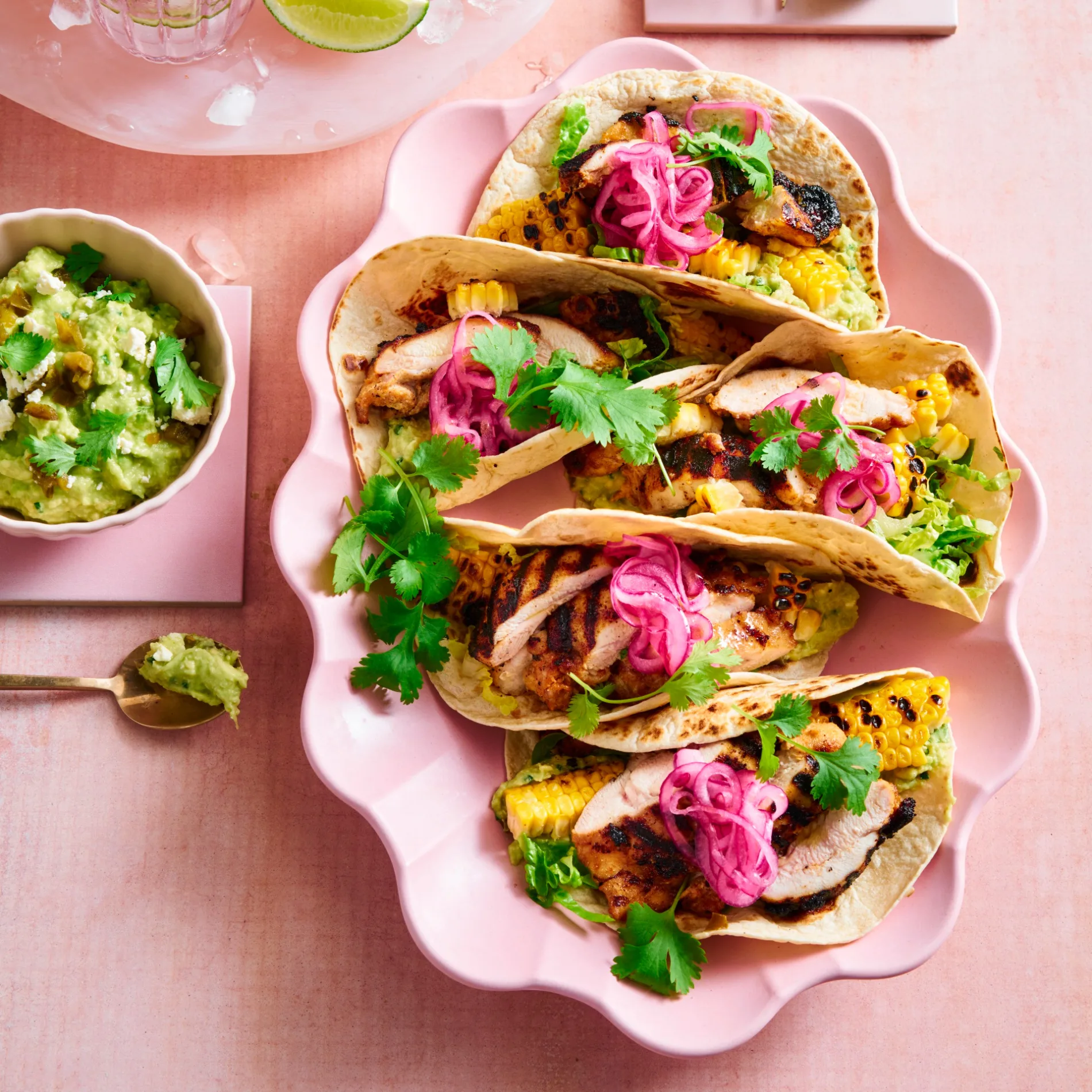 chicken tacos on pink plate