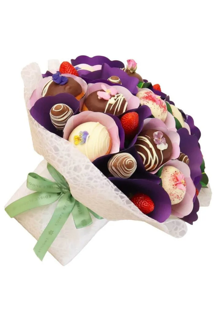 edible arrangement with chocolate covered strawberries and doughnuts