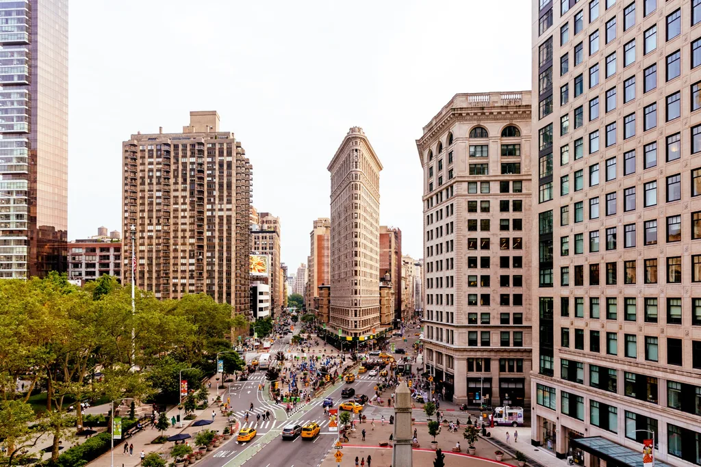 image of flat iron building with crossing in front of it