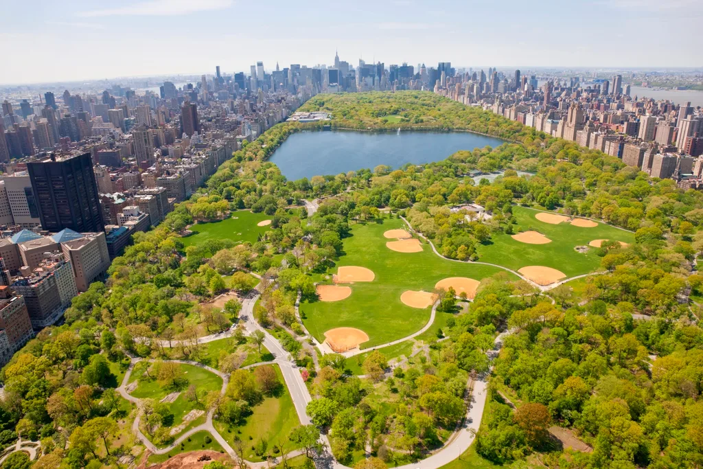 overhead shot of central park in new york with lots of trees and spots for baseball