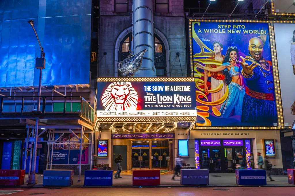 broadway posters in new york with lion king and aladdin