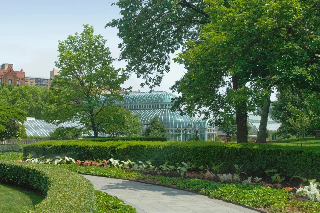 brooklyn botanic gardens with neat hedges and glasshouse in the background