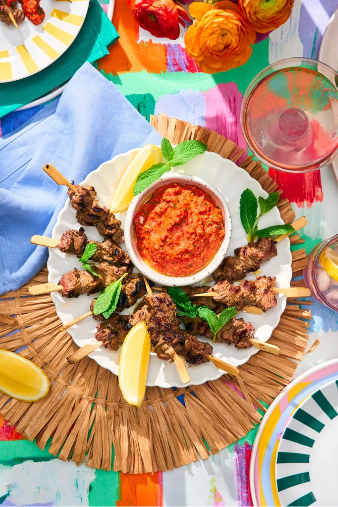 lamb skewers served with roasted capsicum dip and lemon