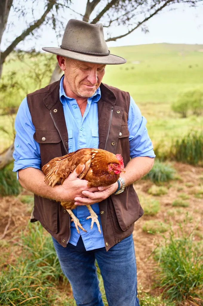 Mat Moran holding a brown chicken