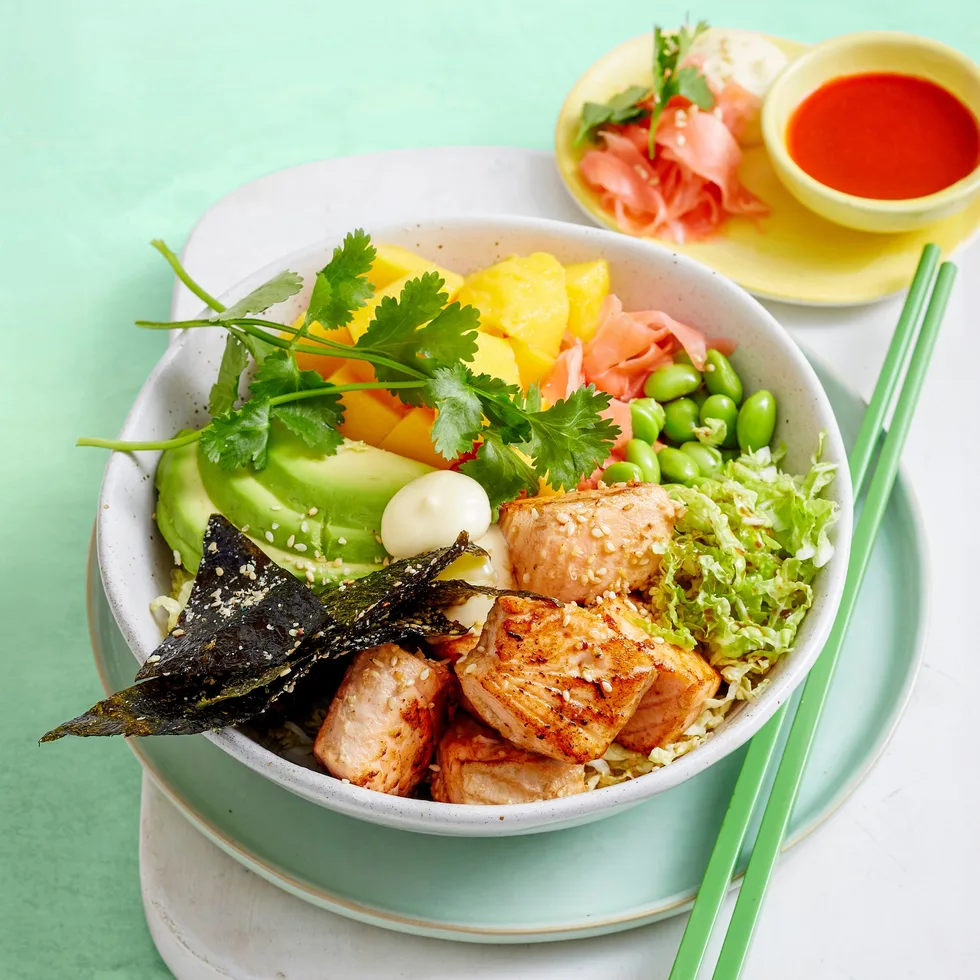 poke bowl with edamame vegetables and chopsticks on the side