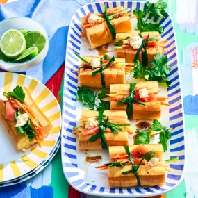 smoked salmon inside brioche rolls with a cucumber salad