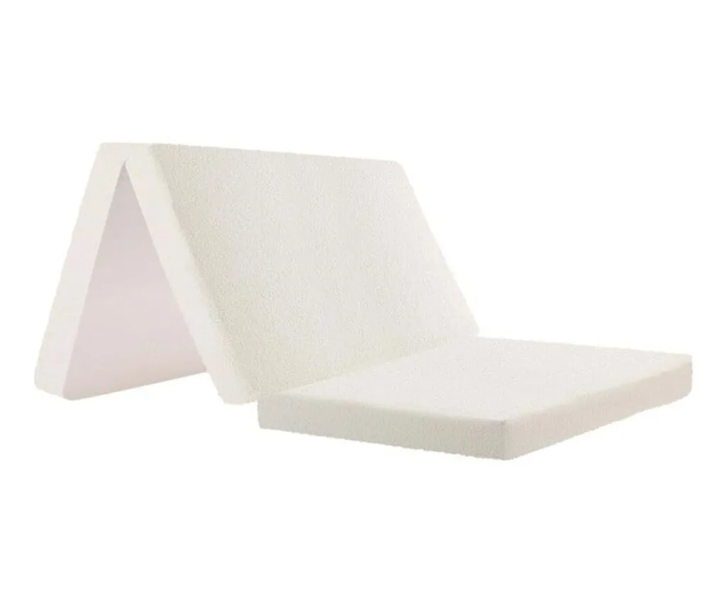 white sherpa fleece folding mattress propped up in middle section