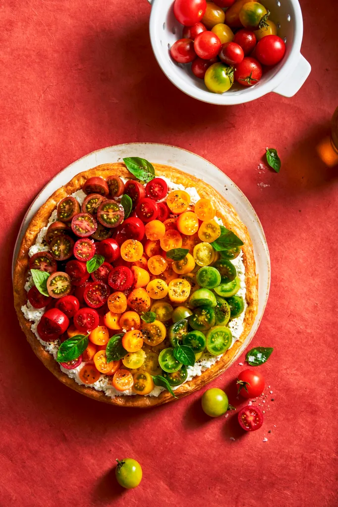 tomato tart with different coloured cherry tomatoes on top in line
