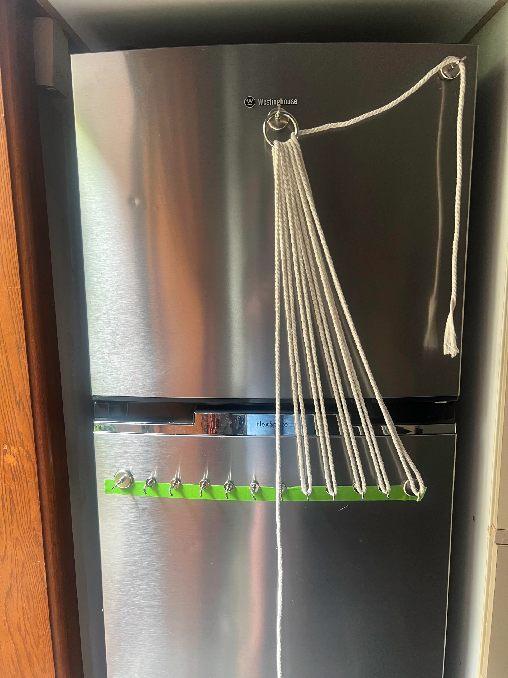 fridge with magnet hooks and macrame rope