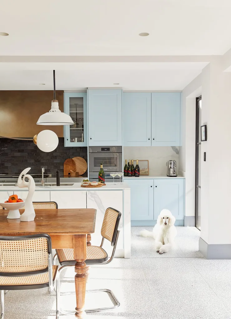 Bright modern kitchen with eclectic dining rooms furnishings.