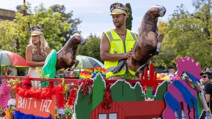 Britt and Taz contestants on The Block 2025 on a float in Daylesford