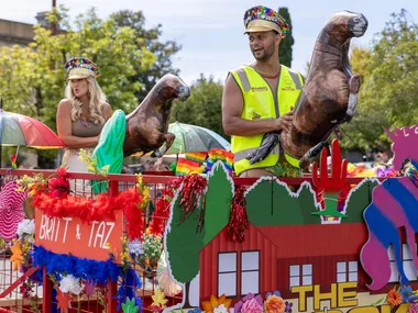 Britt and Taz contestants on The Block 2025 on a float in Daylesford