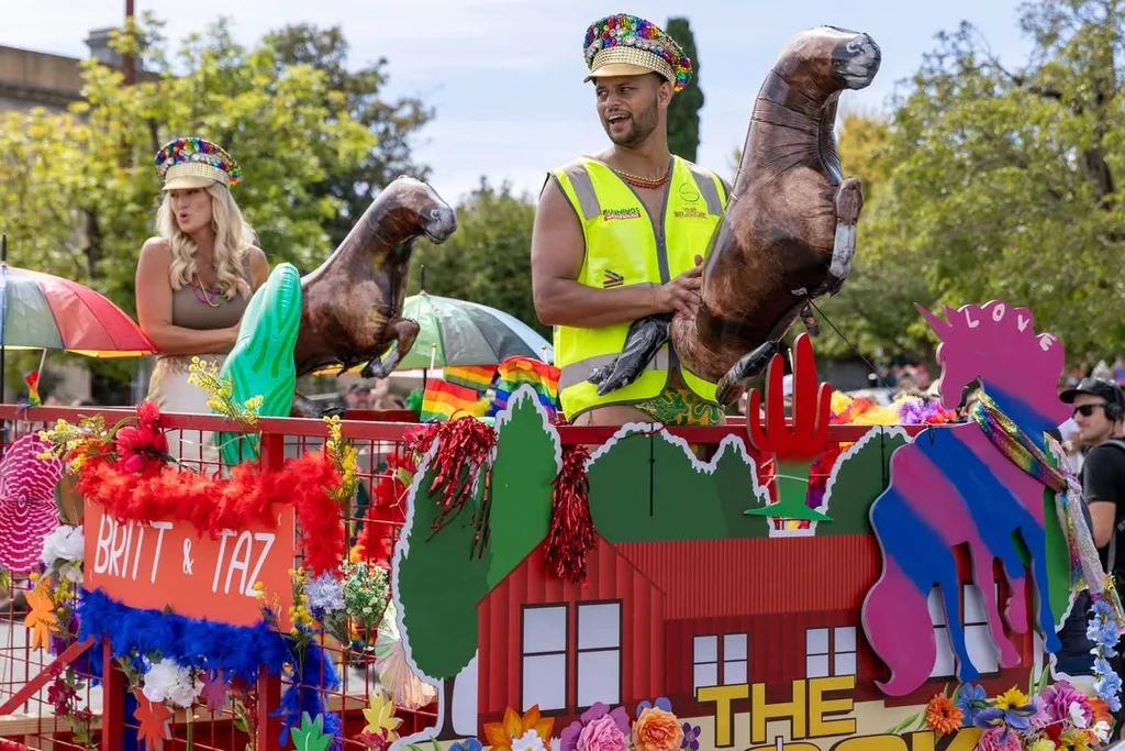 Britt and Taz contestants on The Block 2025 on a float in Daylesford