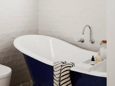 Classic black and white bathroom with claw-foot bath tub