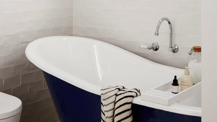 Classic black and white bathroom with claw-foot bath tub
