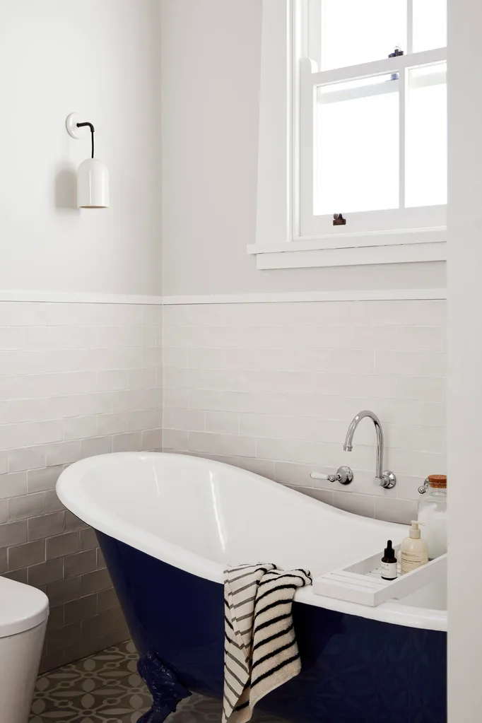 Classic black and white bathroom with claw-foot bath tub
