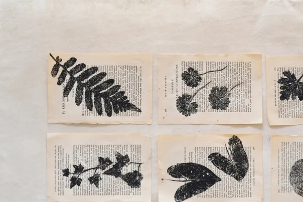 leaf printing artwork on old book pages
