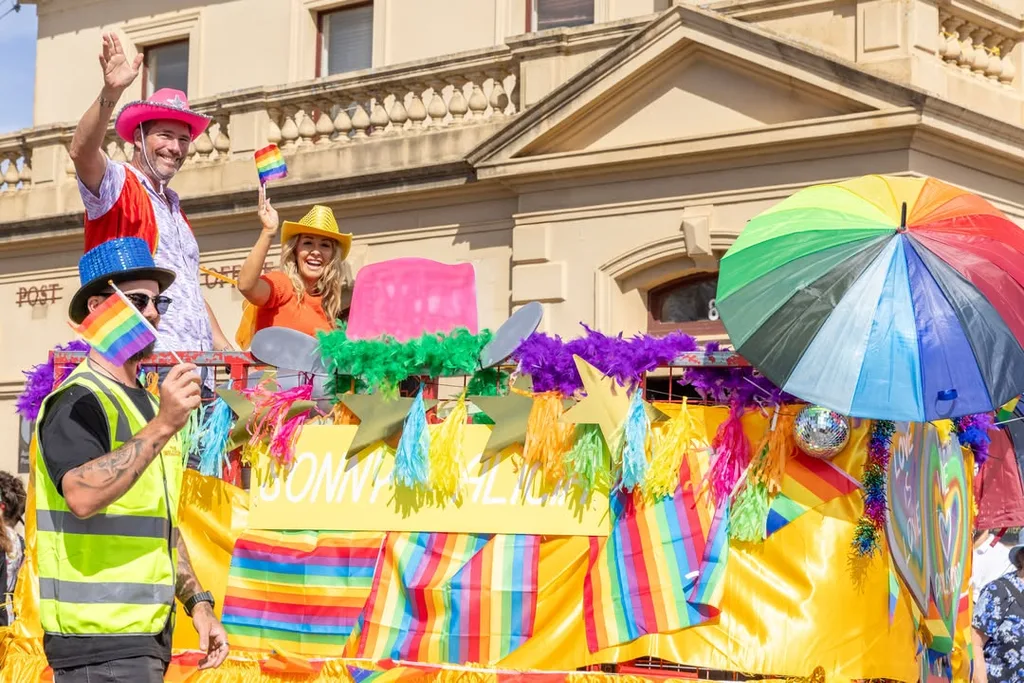 Sonny and Alicia, contestants on The Block 2025 on a float in Daylesford