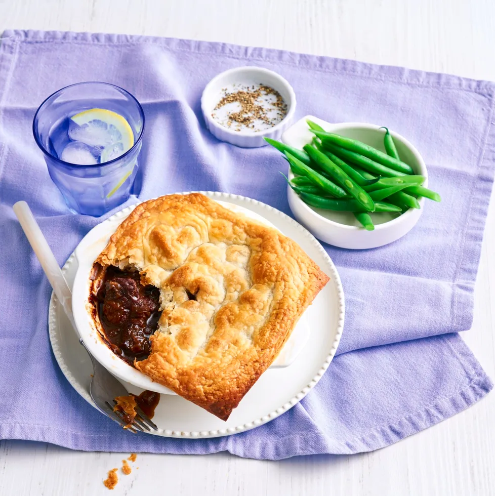 pie for one with spoon cut out of it on a purple tablecloth