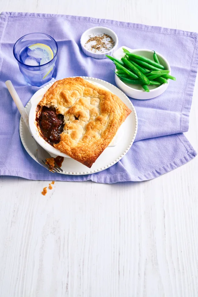 pie for one with spoon cut out of it on a purple tablecloth
